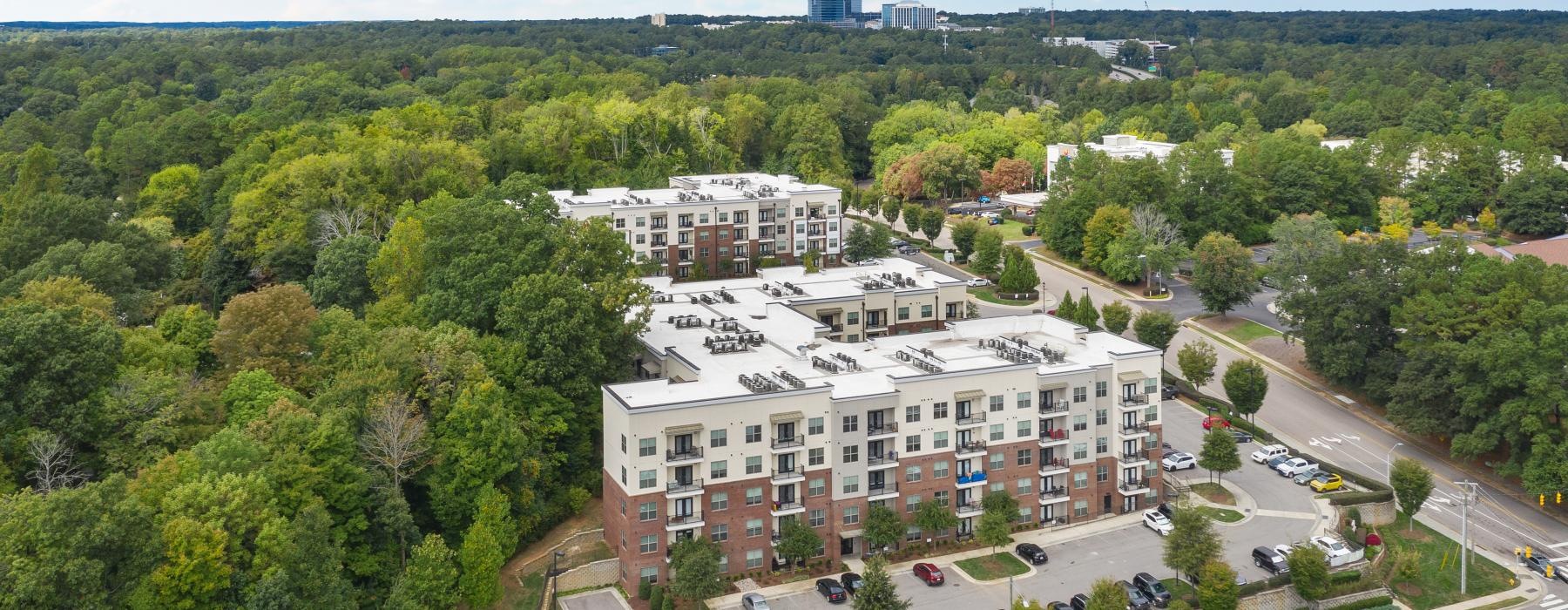 a large building surrounded by trees