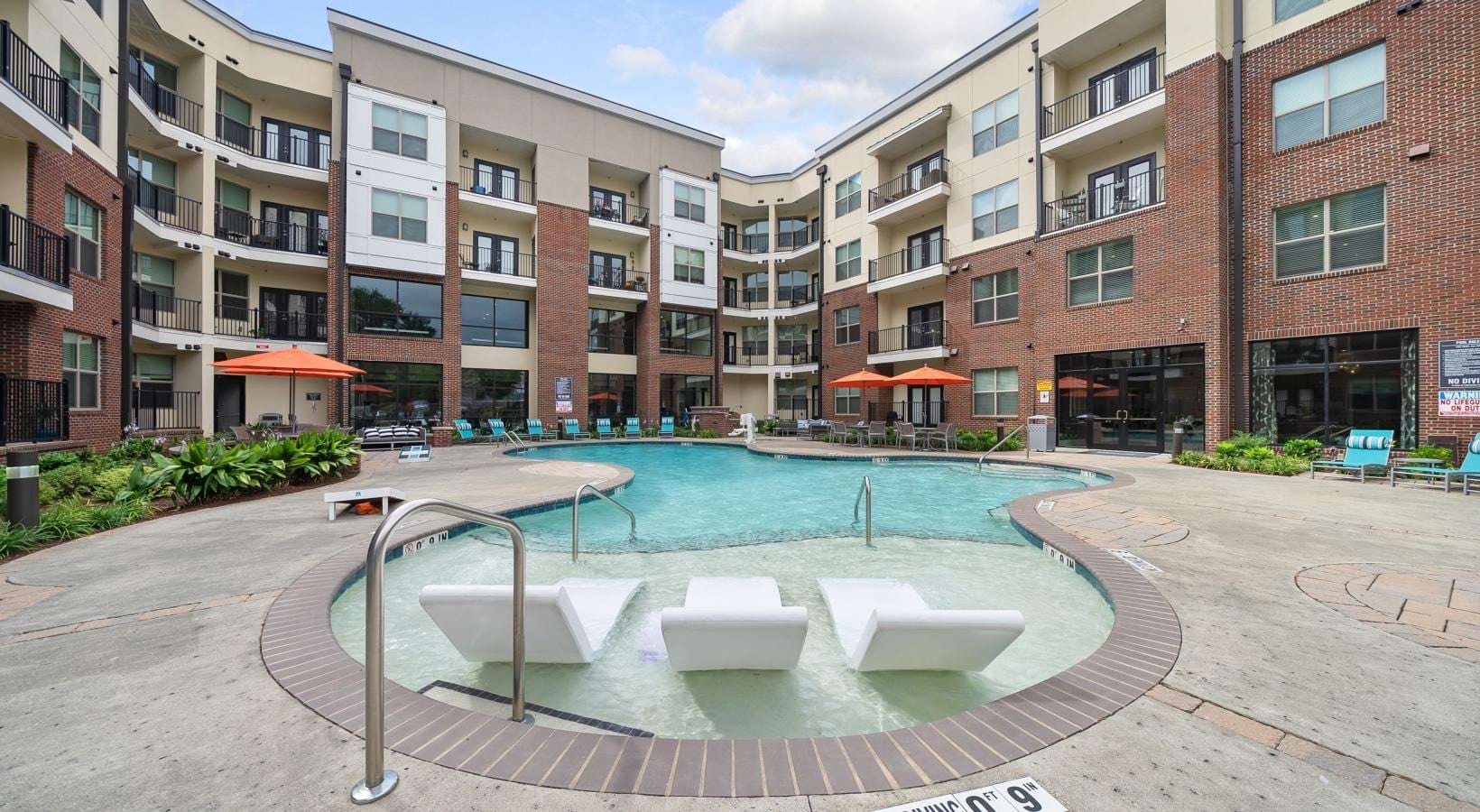 The essence of exceptional living a pool in a courtyard between buildings