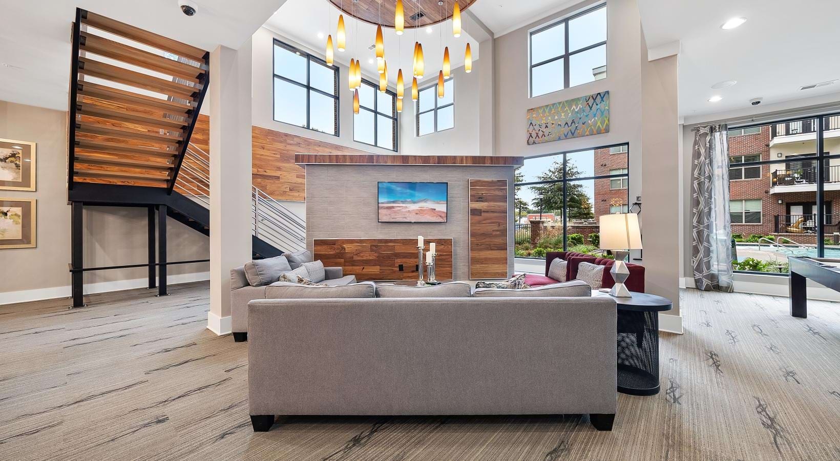 Find your perfect fit at Jones Grant a large living room with a large staircase