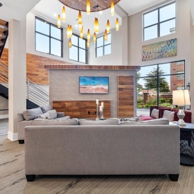 Find your perfect fit at Jones Grant a large living room with a large staircase