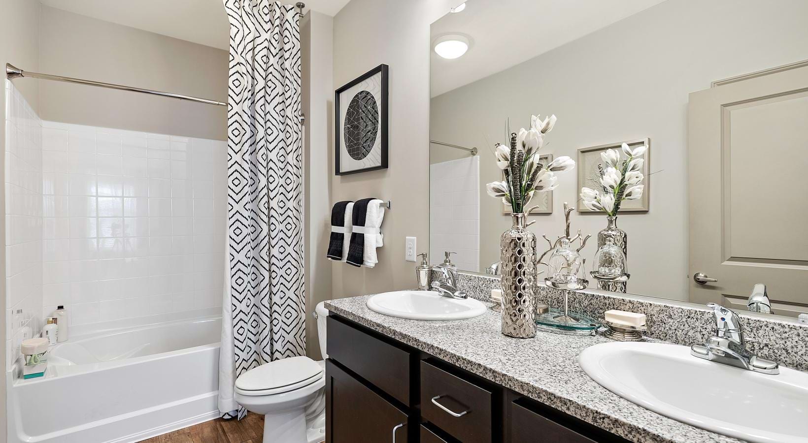 Bathroom options with thoughtful details a bathroom with a tub sink and a toilet