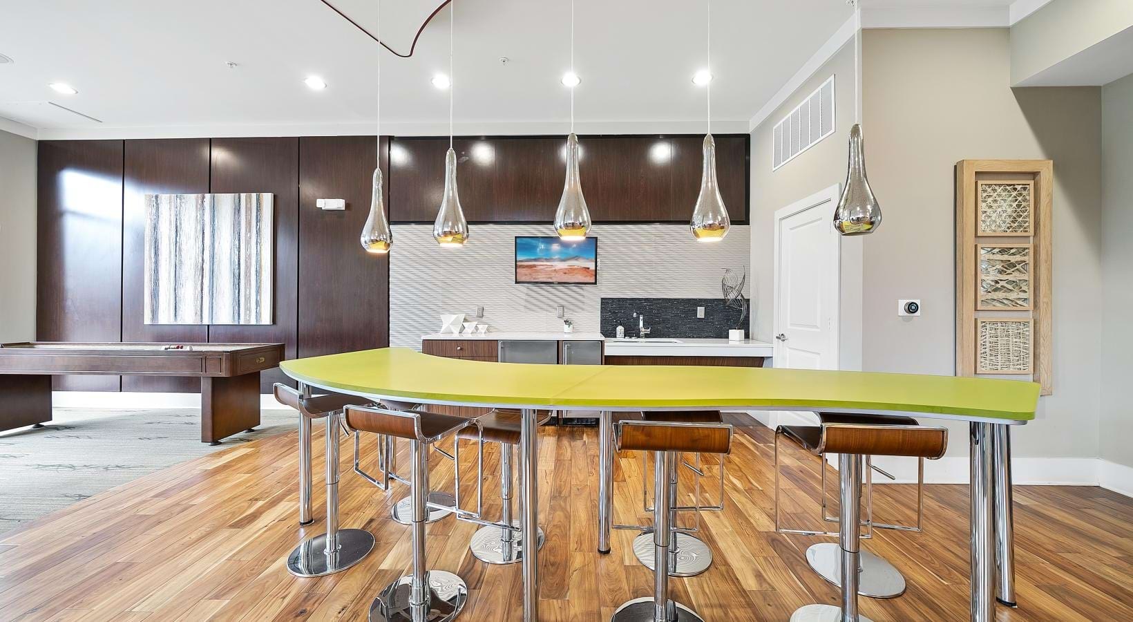 Enjoy our resident-only features a bar with stools and lights