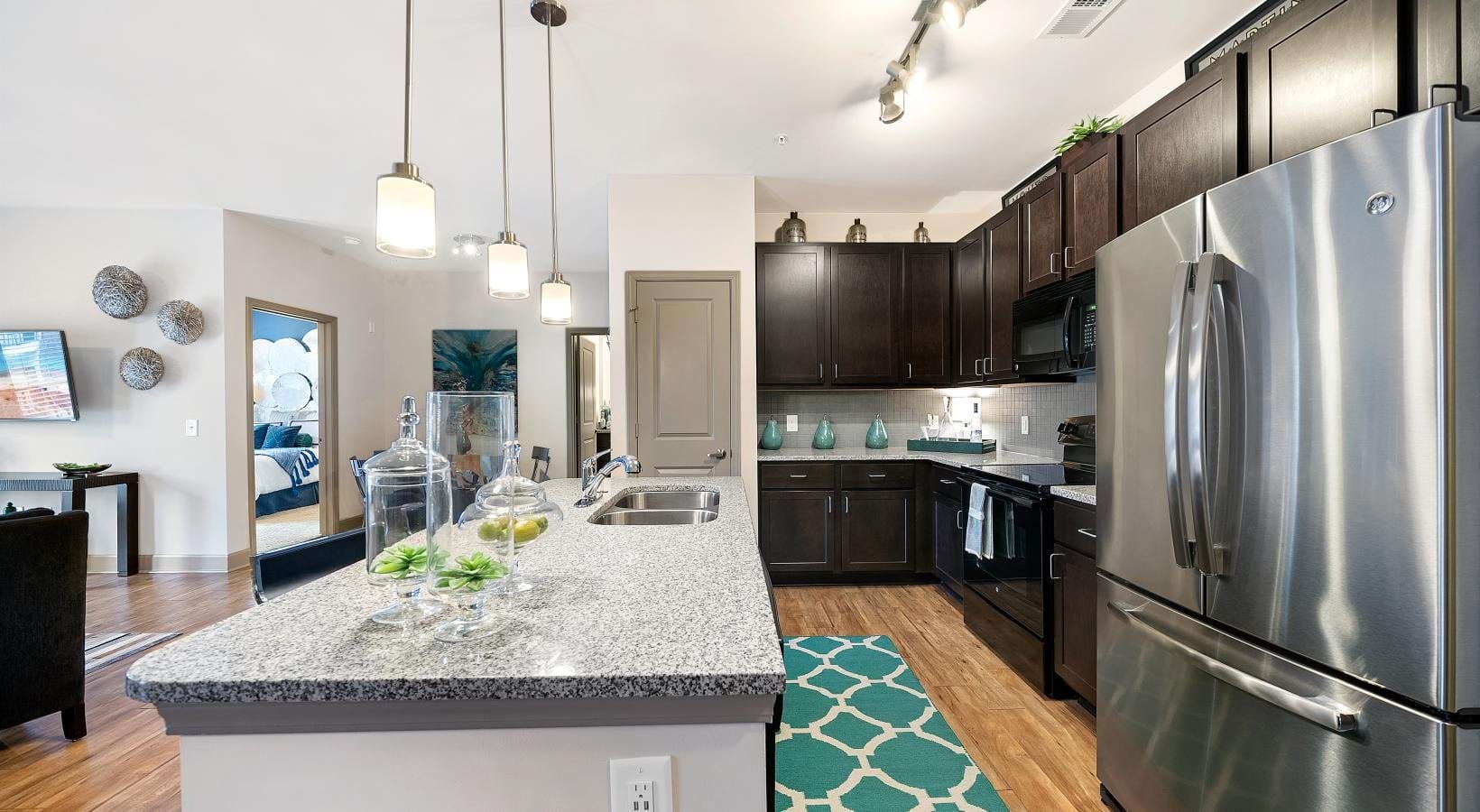 Spacious kitchens with thoughtful details a kitchen with a marble countertop