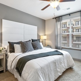 Beautiful bedrooms to fit every need a bedroom with a bed and a fan