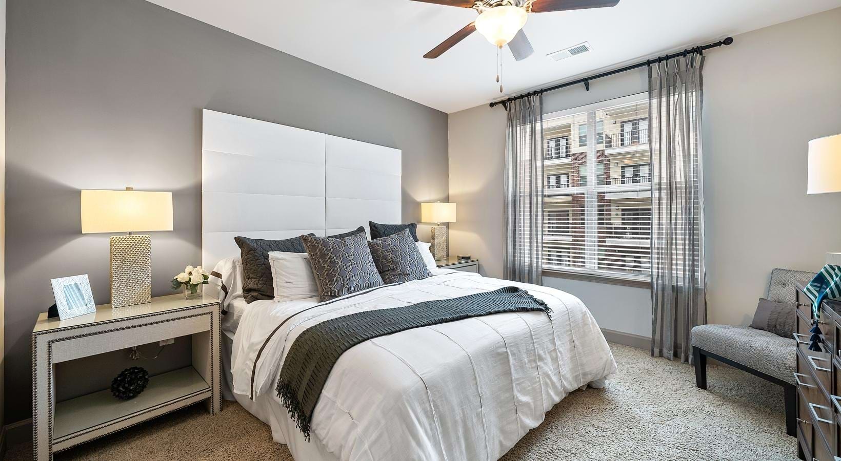 Beautiful bedrooms to fit every need a bedroom with a bed and a fan
