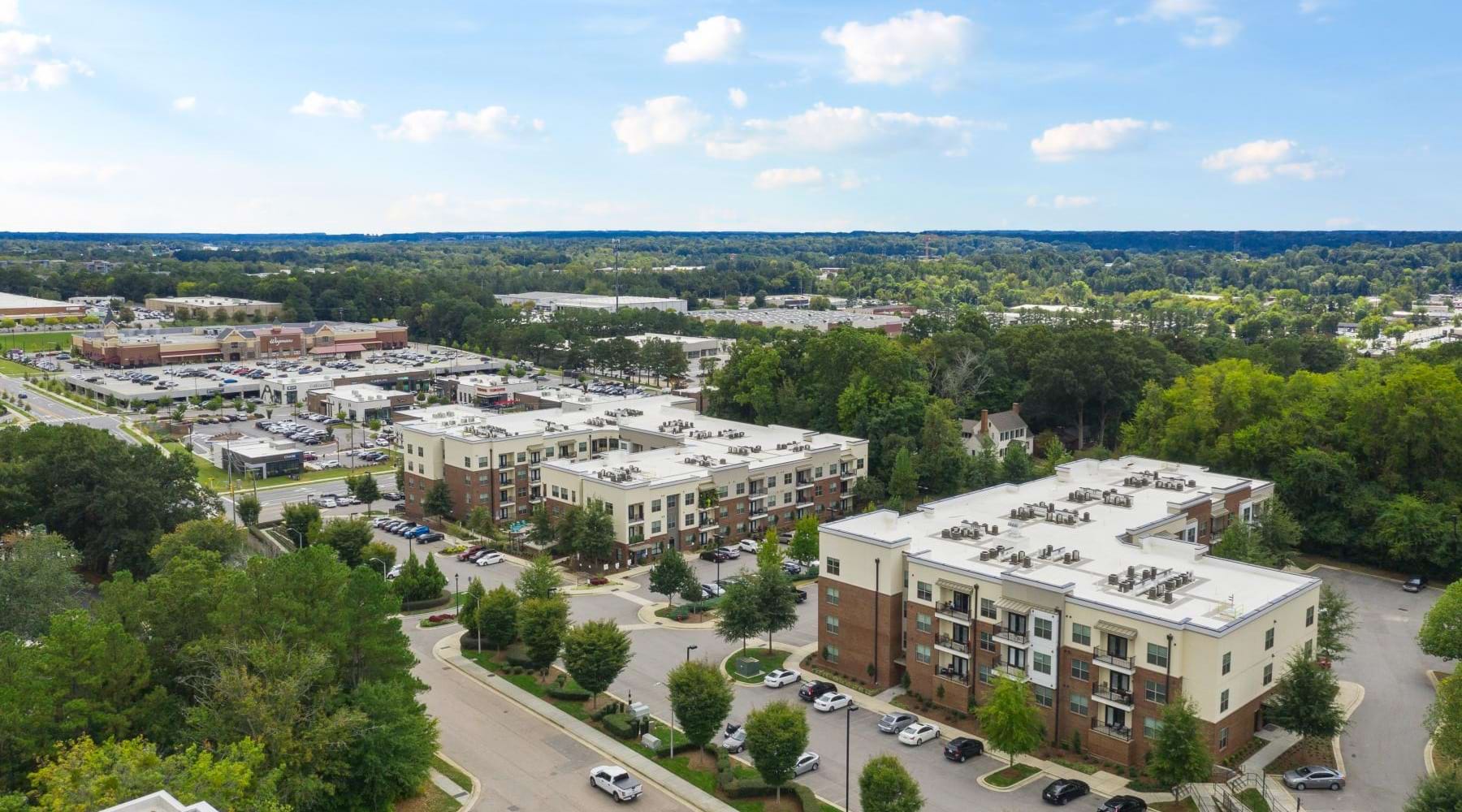 Find your perfect fit at Jones Grant Aerial view of Jones Grant Raleigh apartments for rent, adorned with lush walkable green spaces.