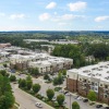 Aerial view of Jones Grant Raleigh apartments for rent, adorned with lush walkable green spaces.