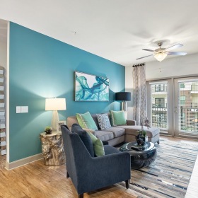 Relax and unwind in stylish living spaces a living room with a blue wall